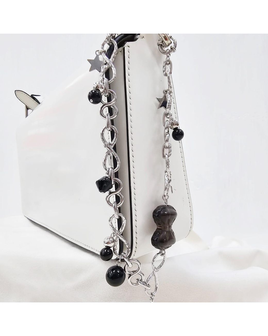 Farra Metallic Smoky Quartz Bowknot With Obsidian Chain Bag Charm