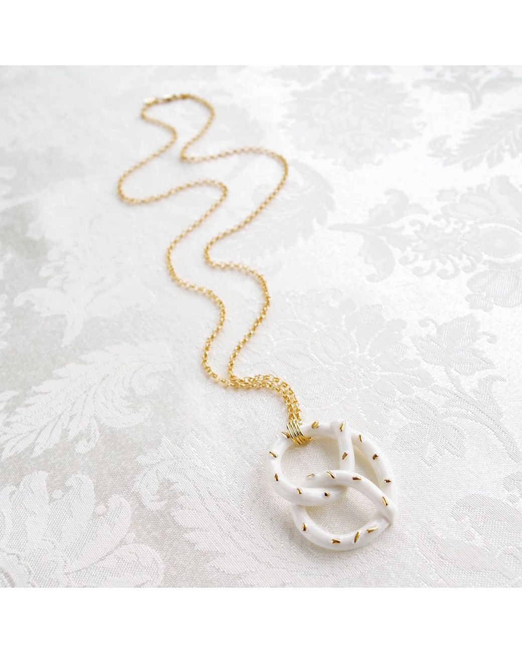 POPORCELAIN Metallic Golden Salted Porcelain Pretzel Pendant Necklace