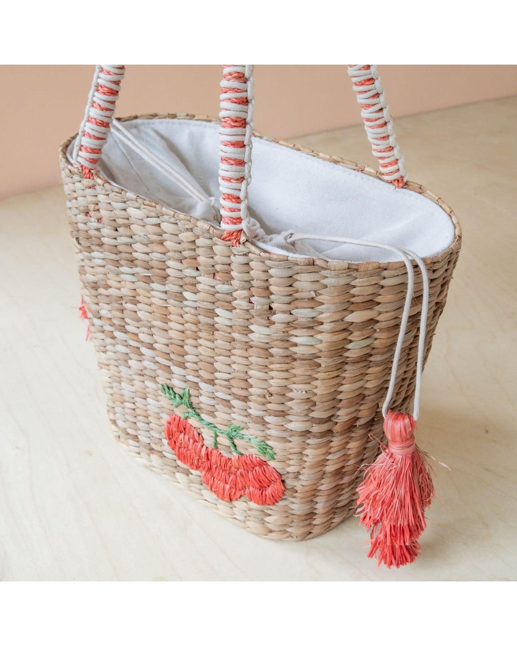 LIKHÂ Pink Neutrals Handwoven Seagrass Tomato Tote Bag With Tassels