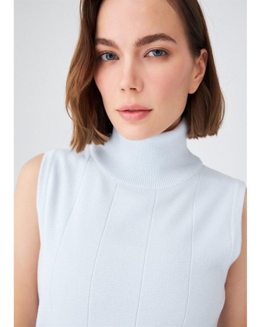 Peraluna Blue Slim Fit Sleeveless Turtle-Neck Blouse