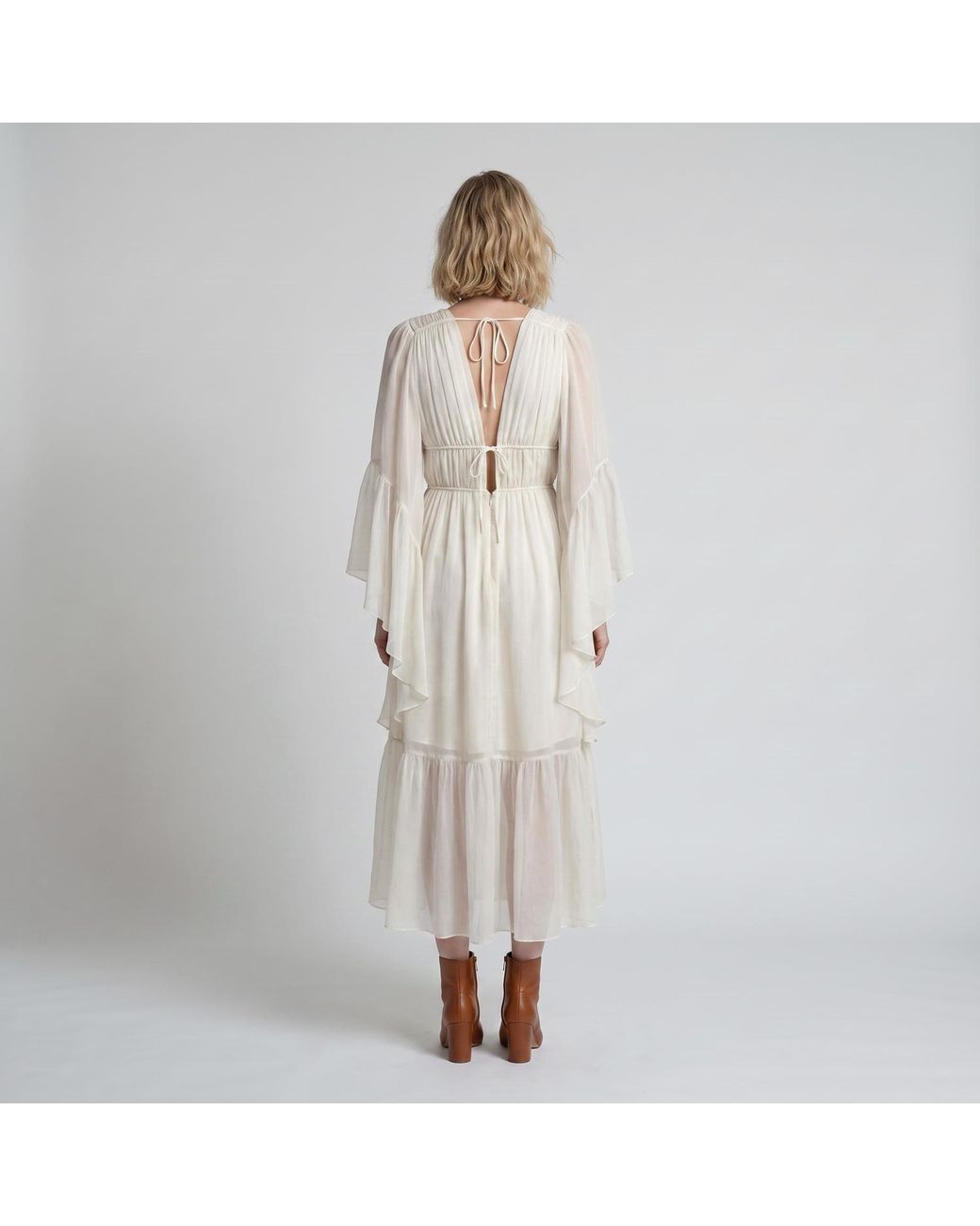 Modenaire White Vacation Style Ruffle Sleeve Maxi Dress With Plunging Neck & Tie Waist