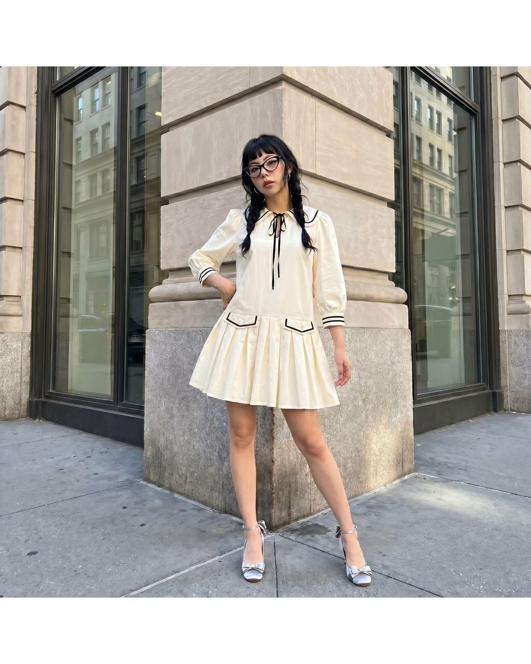 Modenaire Natural Neutrals Long Sleeve Mini Dress With Peter Pan Collar Front Tie Detail Contrast Trim Pockets And Soft Pleated Skirt