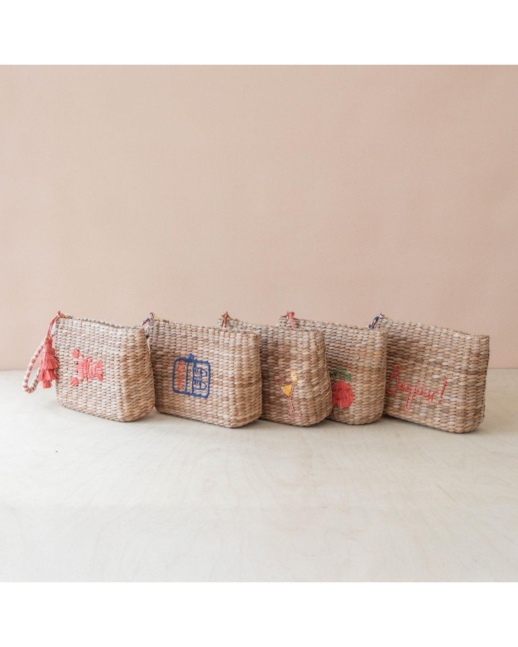 LIKHÂ Red Neutrals Handwoven Seagrass Tomato Wristlet Pouch With Tassels