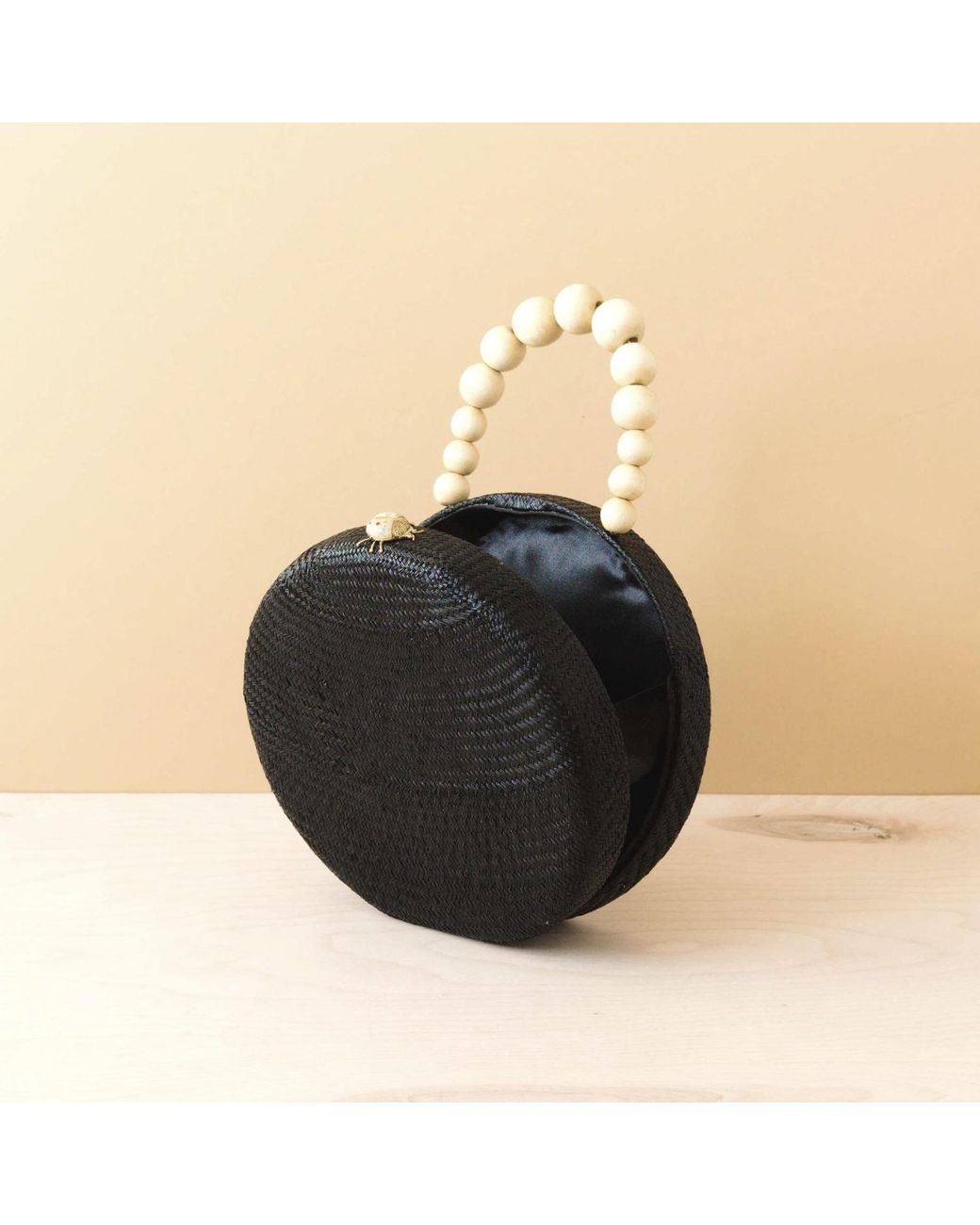 LIKHÂ Black Round Classic Handbag With Wood Handle