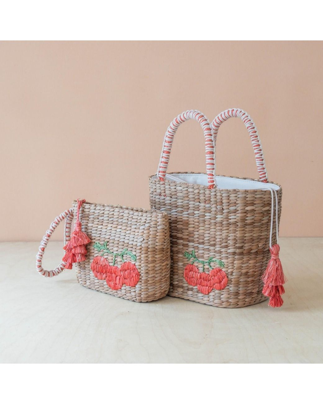LIKHÂ Pink Neutrals Handwoven Seagrass Tomato Tote Bag With Tassels