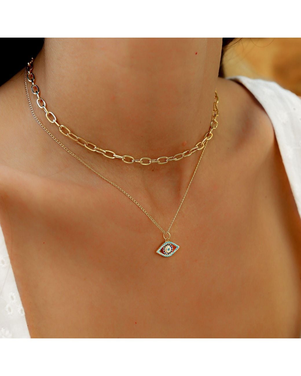 Lexi Jewelry Metallic Evil Eye Necklace With Cubic Zirconia & Aquamarine Colored Accents