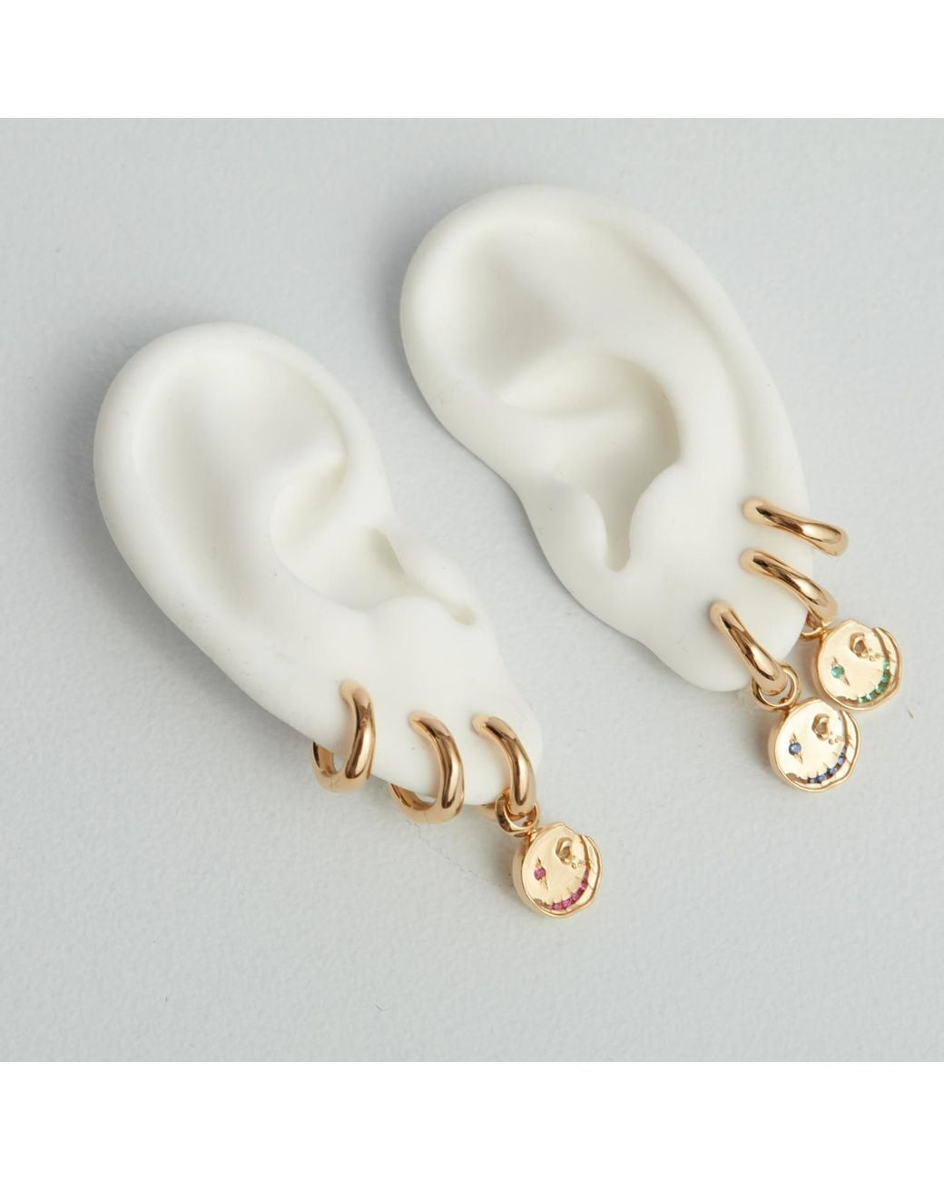 Kasun Metallic Smile Hoop Earrings – July – Ruby – Plated