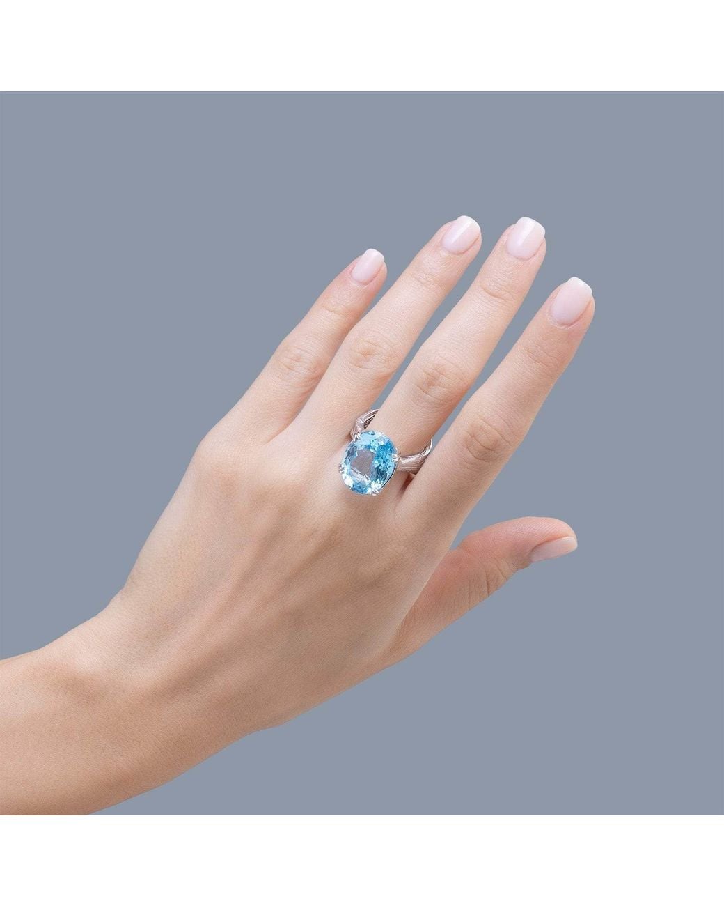 German Kabirski Blue Nila Textured Ring With Natural Oval Cut Topaz