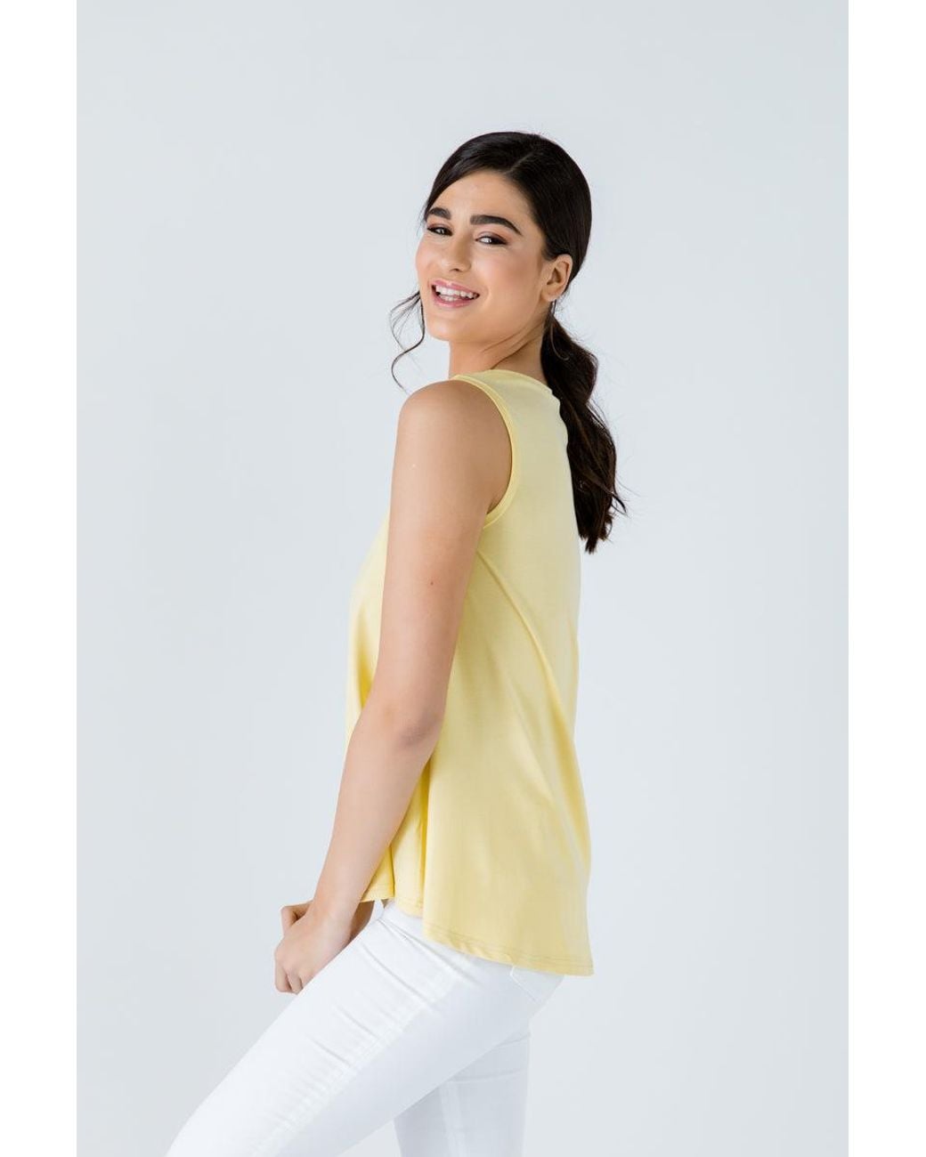 Conquista Yellow Sleeveless Top With Rounded Hemline