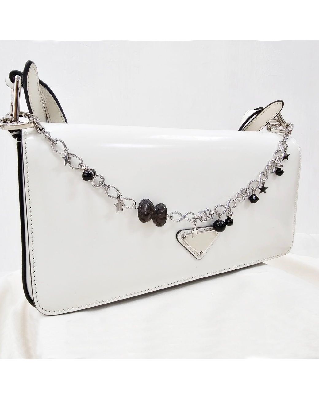 Farra Metallic Smoky Quartz Bowknot With Obsidian Chain Bag Charm