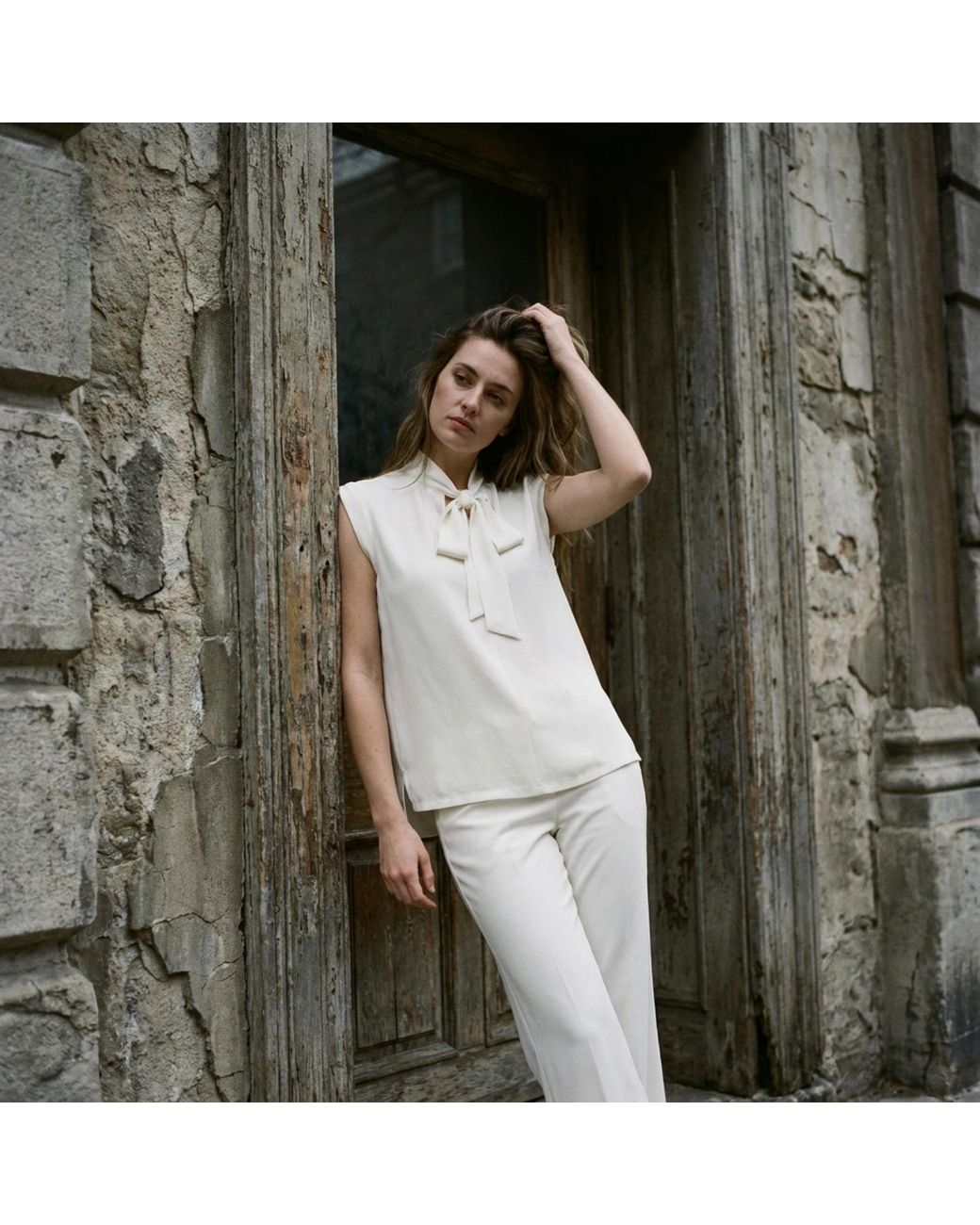 Modenaire White Sleeveless Tie Neck Blouse And Wide Leg Pant Set