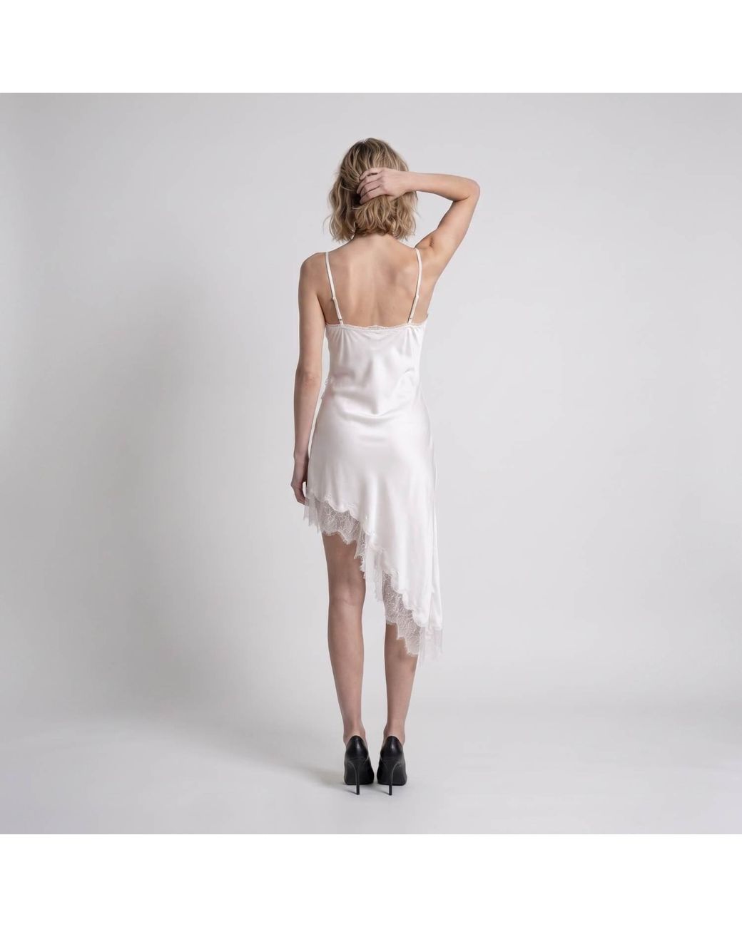 Modenaire White Asymmetric Satin Slip Dress With Lace Trim And Draped Silhouette