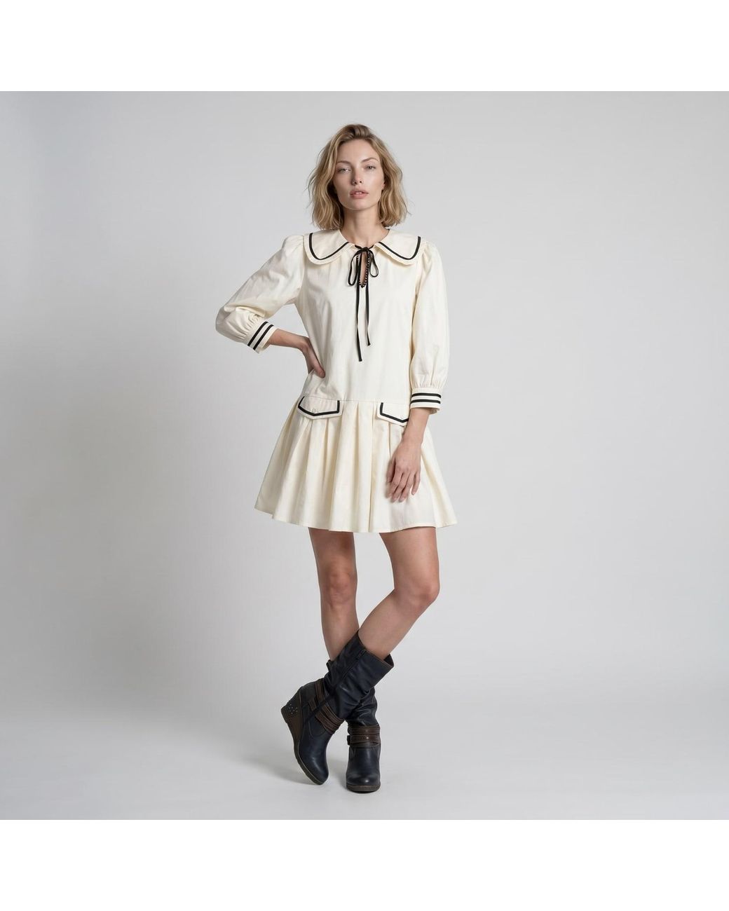 Modenaire Natural Neutrals Long Sleeve Mini Dress With Peter Pan Collar Front Tie Detail Contrast Trim Pockets And Soft Pleated Skirt