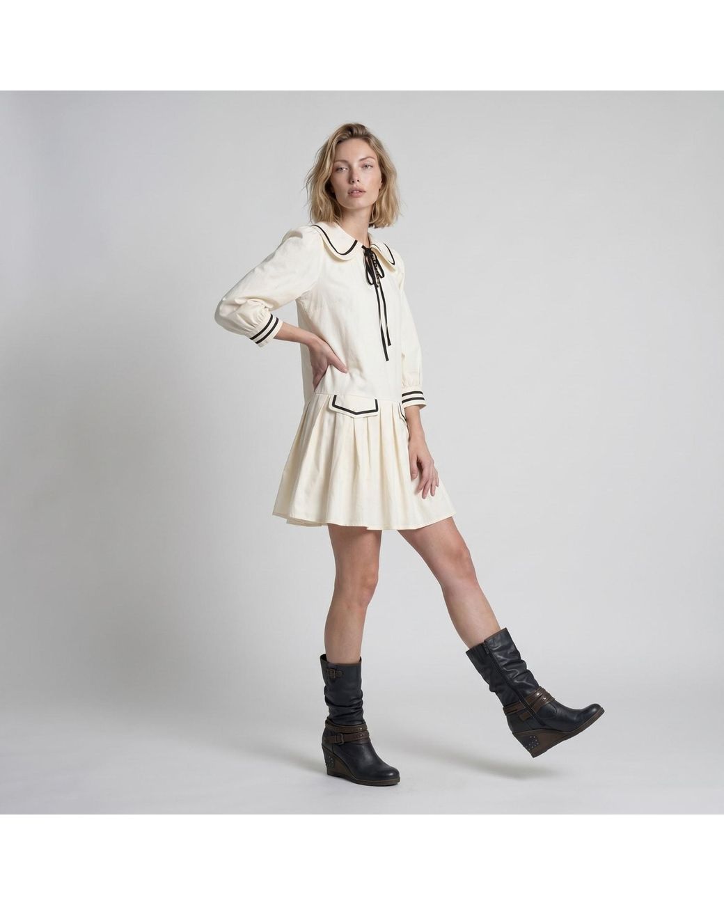 Modenaire Natural Neutrals Long Sleeve Mini Dress With Peter Pan Collar Front Tie Detail Contrast Trim Pockets And Soft Pleated Skirt
