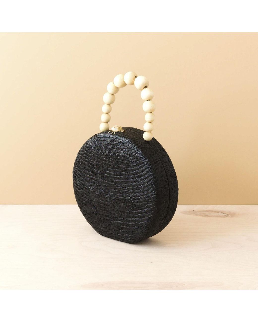 LIKHÂ Black Round Classic Handbag With Wood Handle