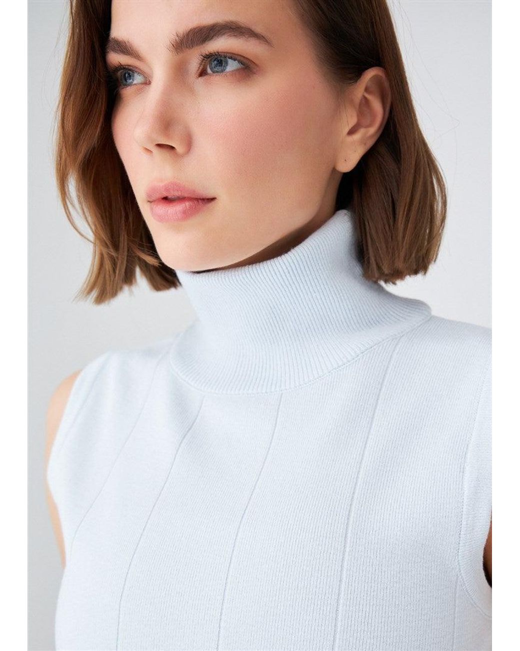 Peraluna Blue Slim Fit Sleeveless Turtle-Neck Blouse