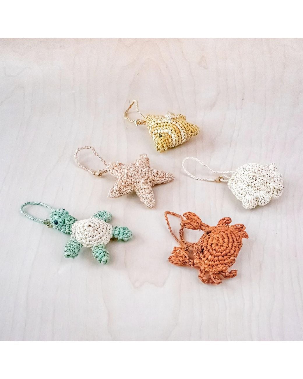 LIKHÂ Metallic Fish Raffia Bag Charm
