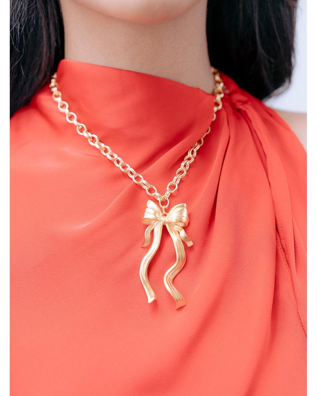 The Pink Reef Metallic Large Sculpted Bow Necklace