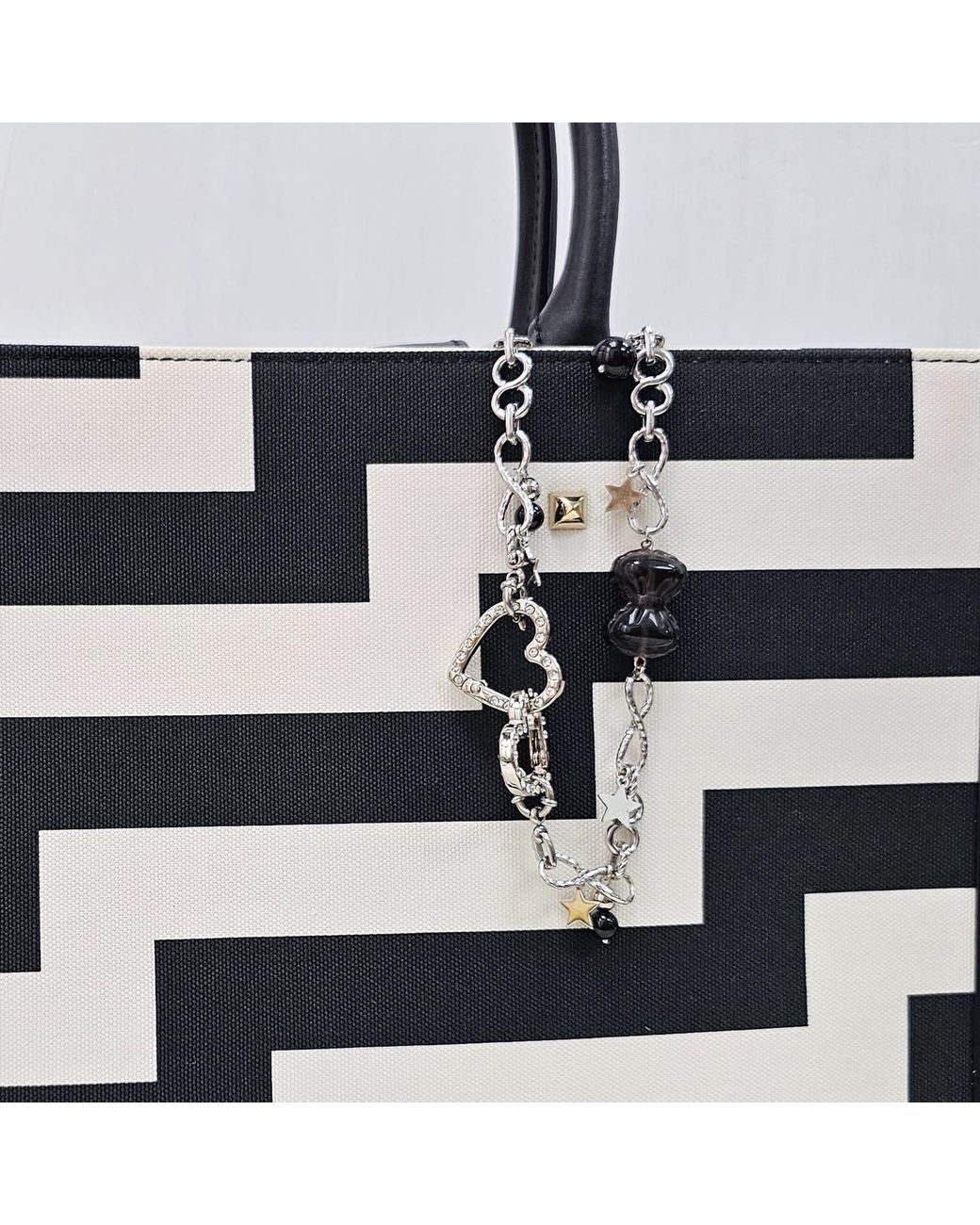 Farra Metallic Smoky Quartz Bowknot With Obsidian Chain Bag Charm