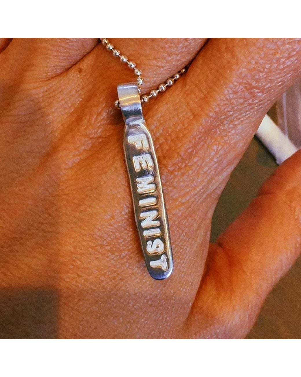The Lila Lobster Metallic Feminist Charm