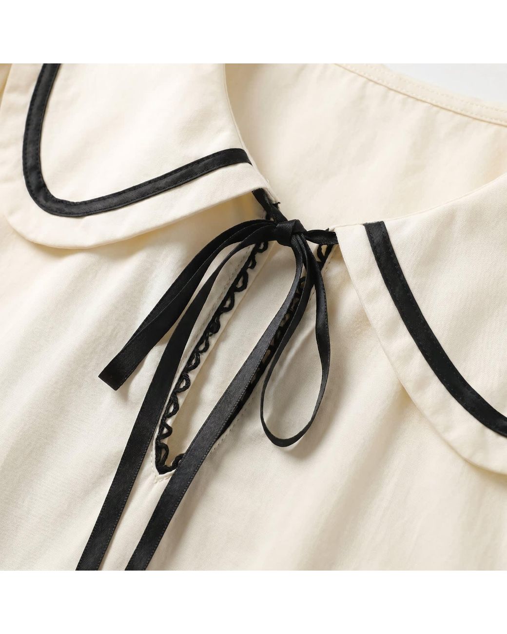 Modenaire Natural Neutrals Long Sleeve Mini Dress With Peter Pan Collar Front Tie Detail Contrast Trim Pockets And Soft Pleated Skirt