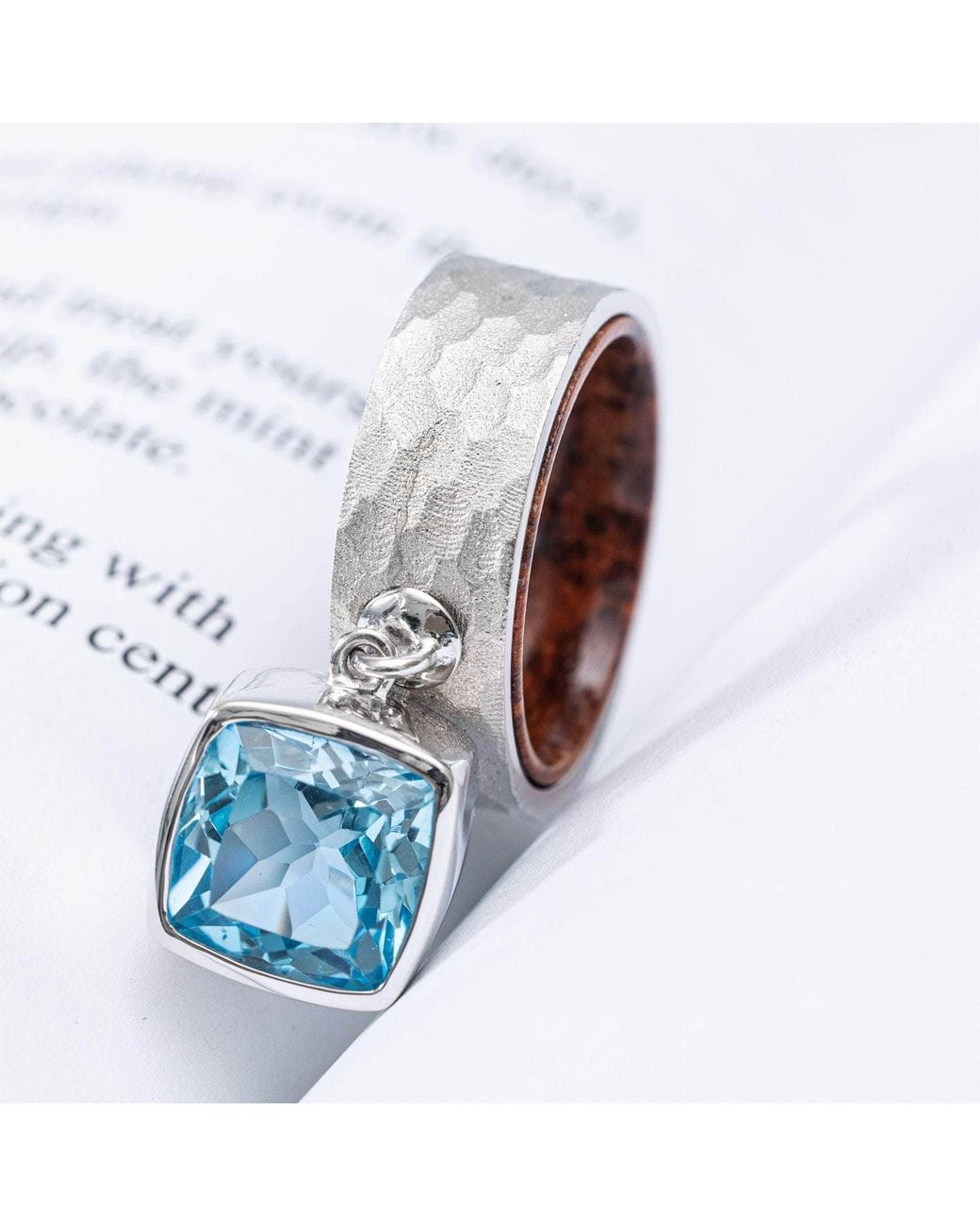 German Kabirski Blue Nixie Ring With Cushion Topaz And Rosewood Core