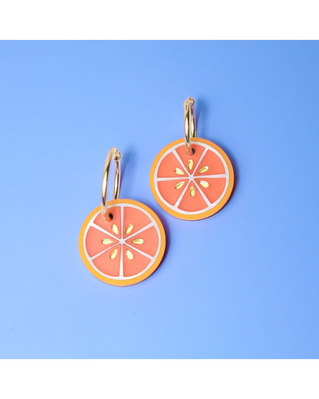 By Chavelli Orange Blood Dangly Hoop Earrings