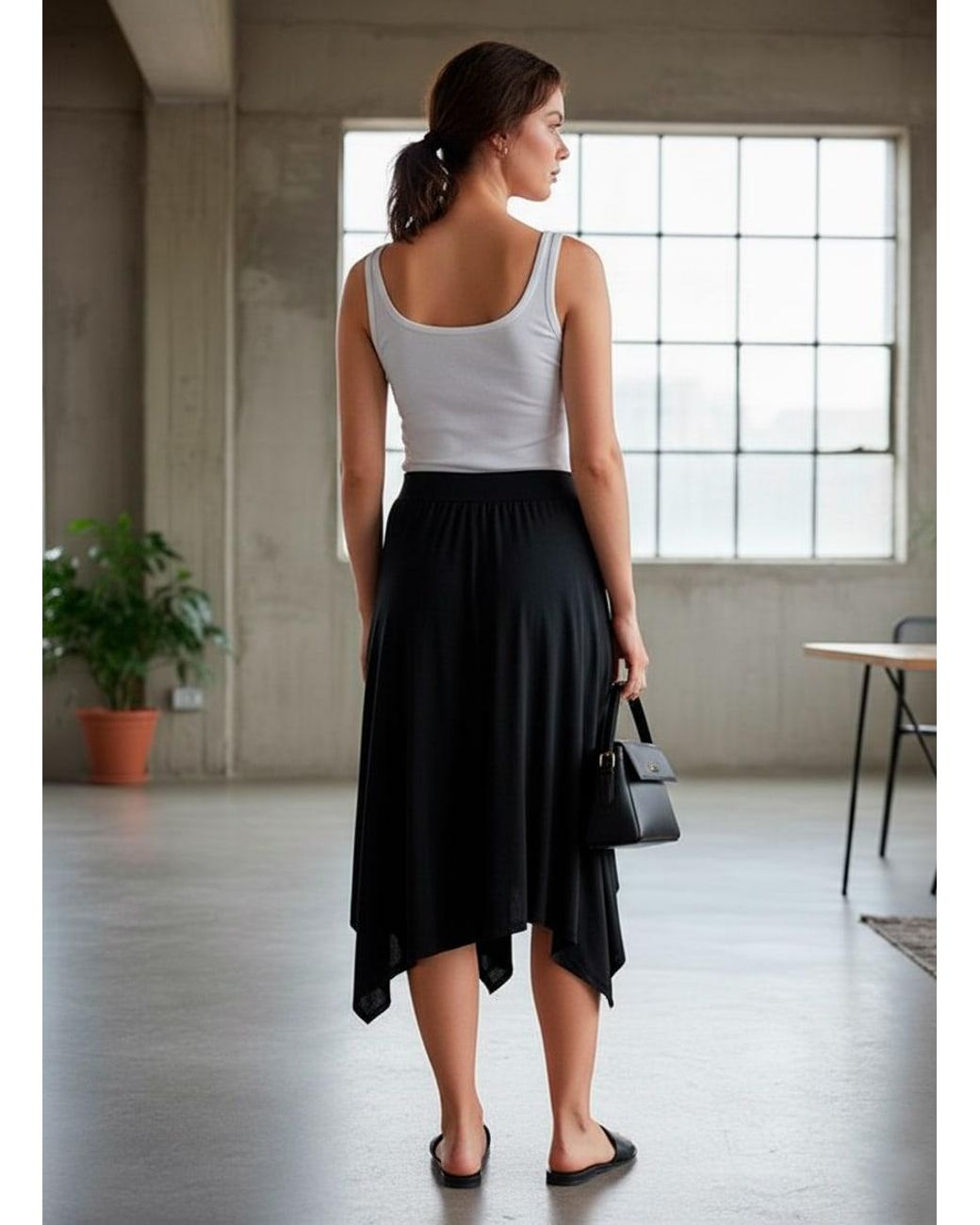 Conquista Black Asymmetric Midi Skirt With Flowing Silhouette
