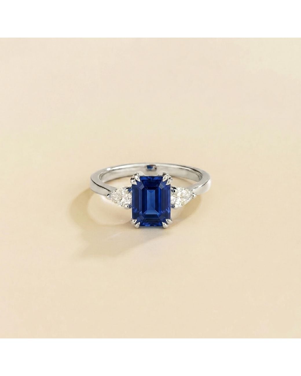 Juvetti Blue Ailes Sapphire Emerald-Cut Ring With Pear Side Diamonds