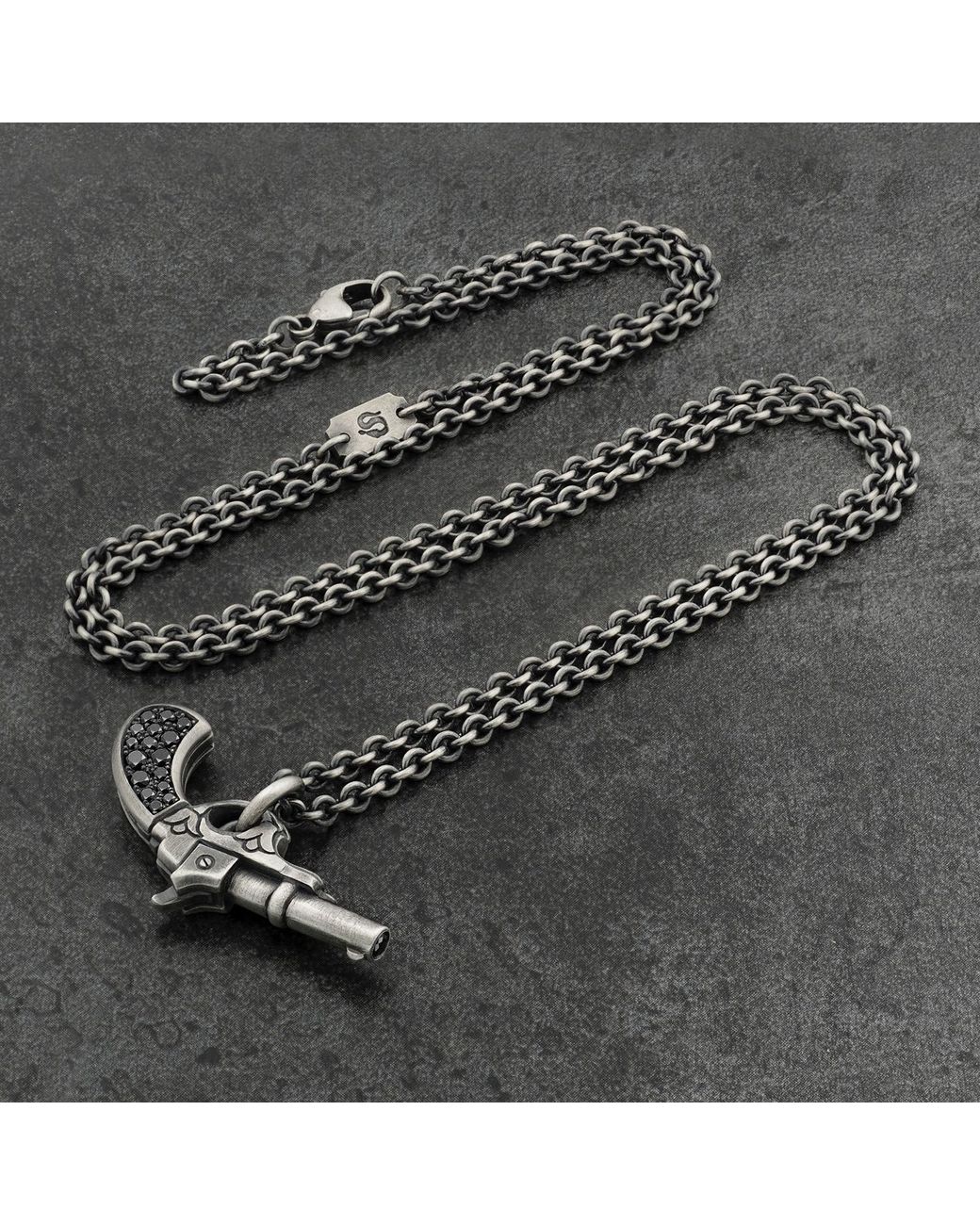Snake Bones Metallic Gun Pendant In Sterling Silver With Black Diamonds for men