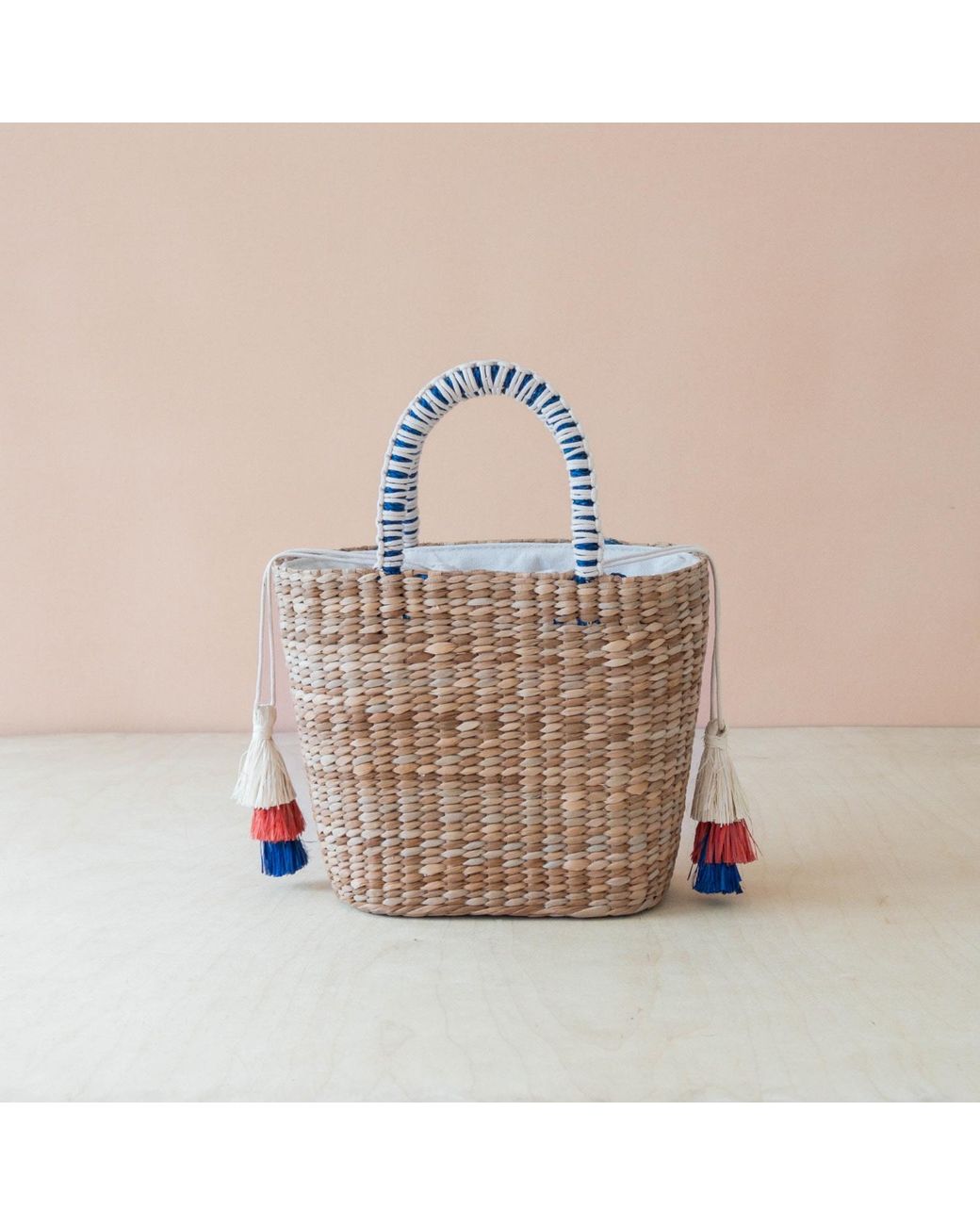 LIKHÂ Blue Neutrals Handwoven Seagrass Sardine Can Tote Bag With Tassels