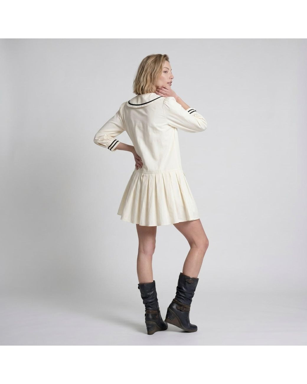 Modenaire Natural Neutrals Long Sleeve Mini Dress With Peter Pan Collar Front Tie Detail Contrast Trim Pockets And Soft Pleated Skirt