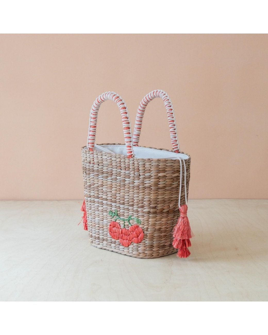 LIKHÂ Pink Neutrals Handwoven Seagrass Tomato Tote Bag With Tassels