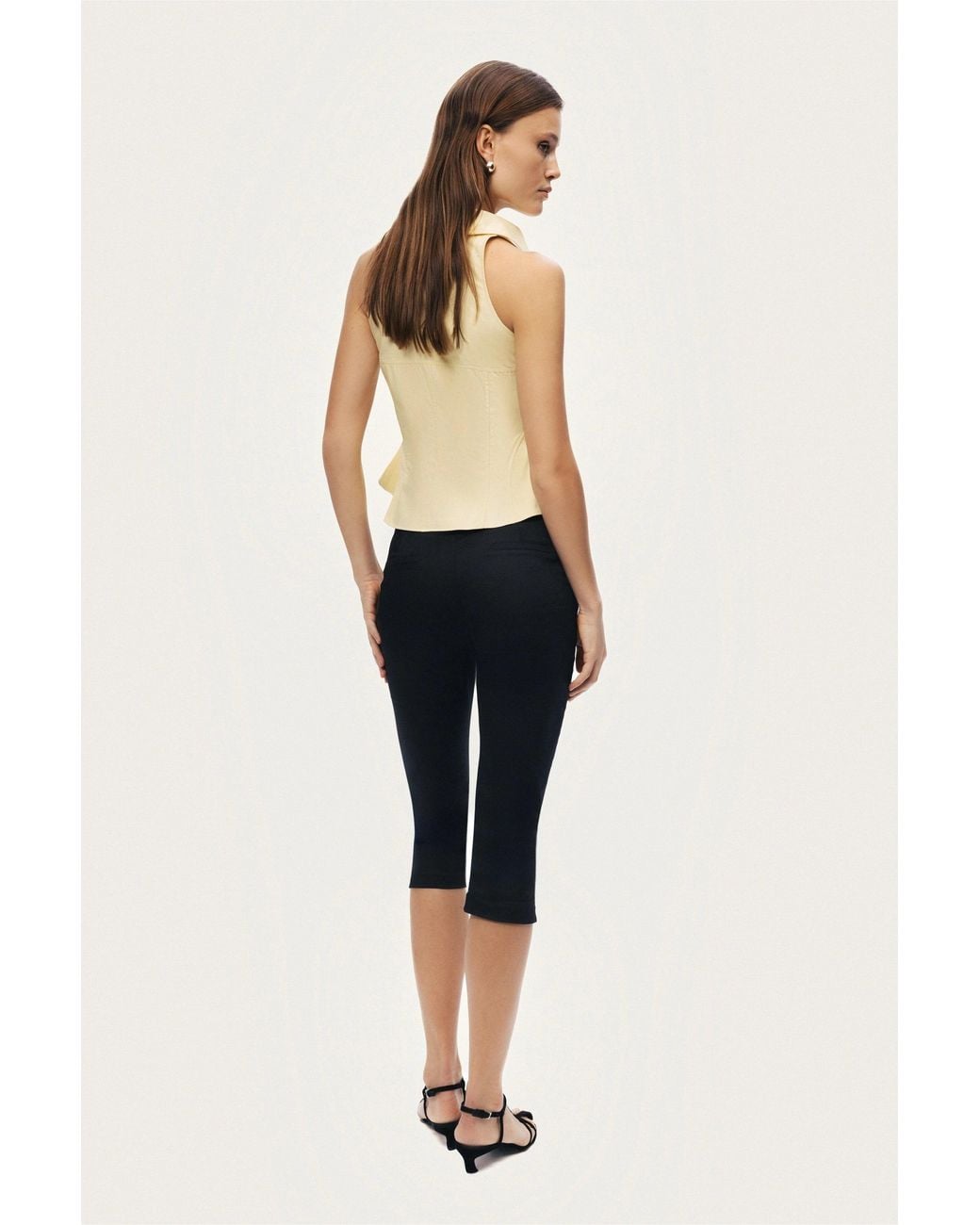 Nocturne White Sleeveless Sculpted Shirt