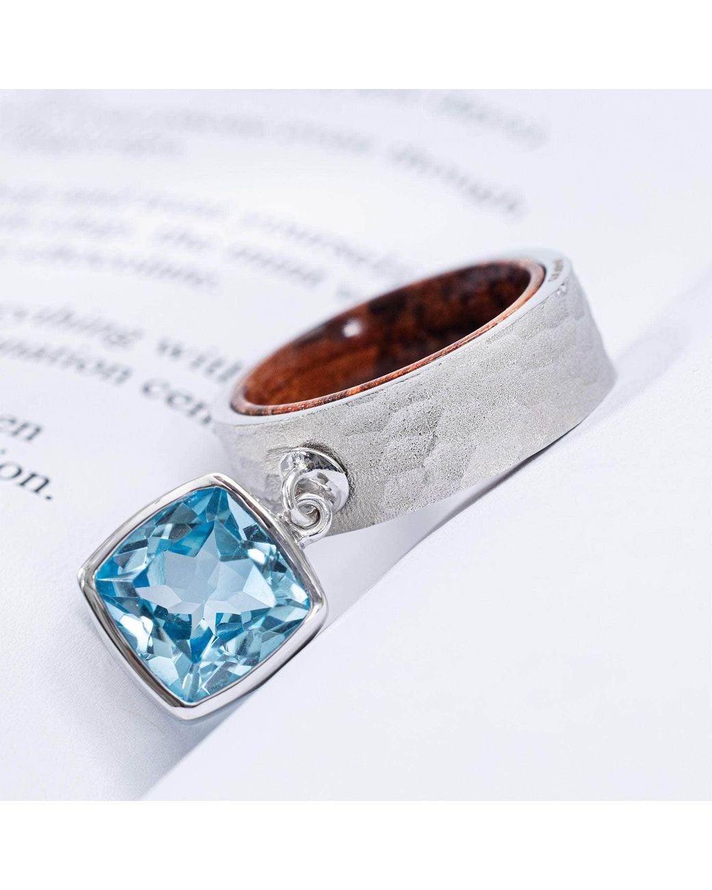 German Kabirski Blue Nixie Ring With Cushion Topaz And Rosewood Core