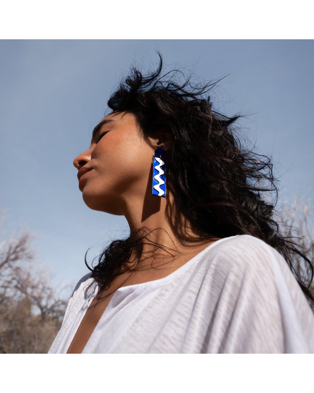 By Chavelli Blue Matisse Wave Dangly Earrings