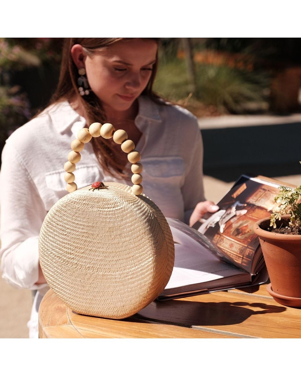 LIKHÂ Natural Oat Round Classic Handbag With Bead Handle