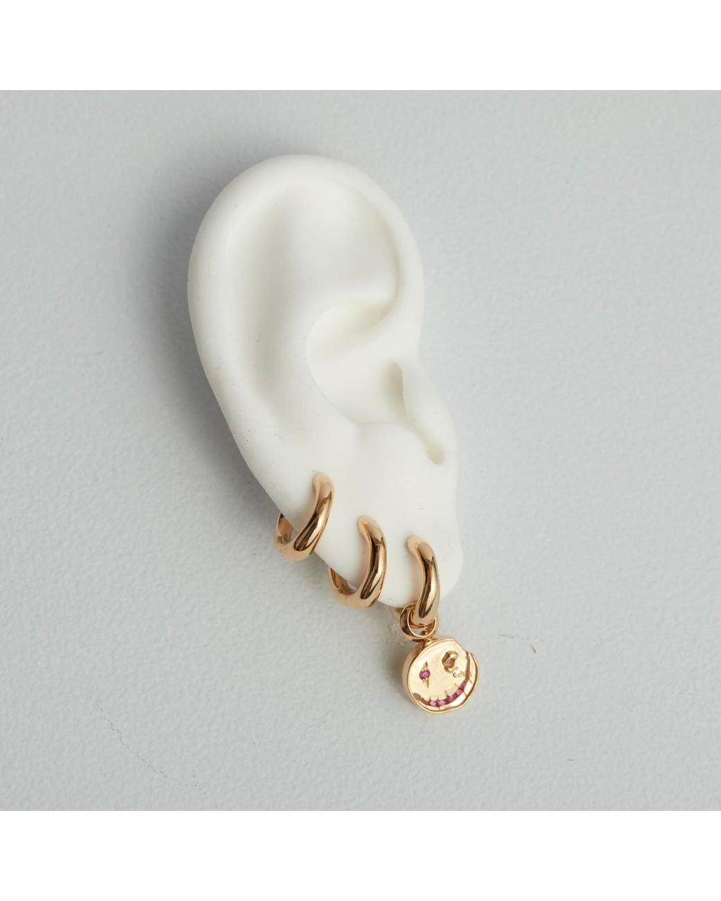 Kasun Metallic Smile Hoop Earrings – July – Ruby – Plated