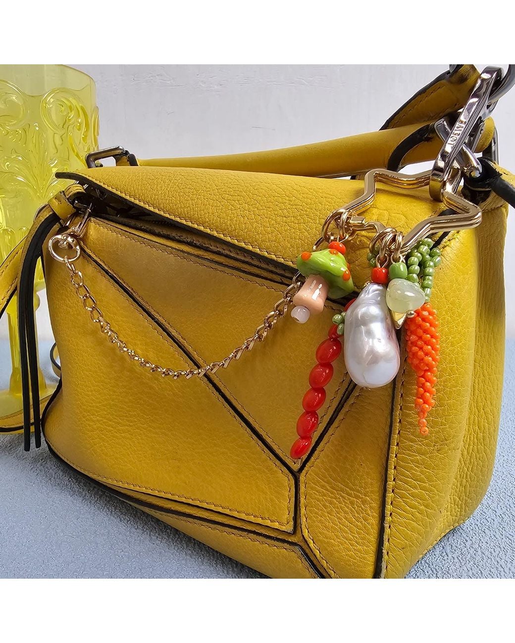 Farra Metallic Baroque Pearl Bamboo Coral And Handcrafted Carrot Bag Charm