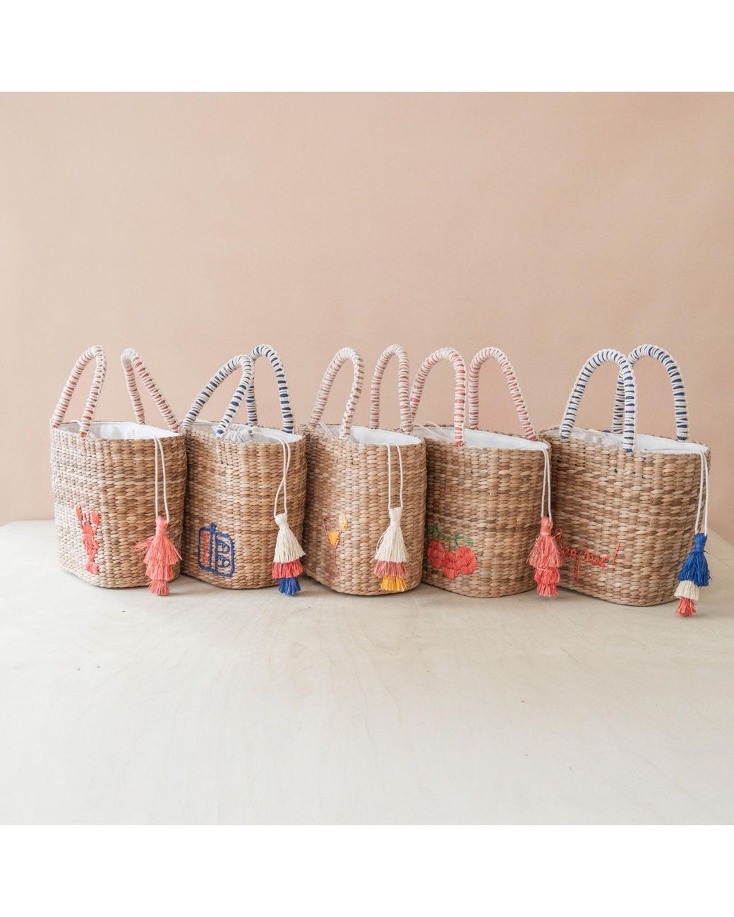 LIKHÂ Pink Neutrals Handwoven Seagrass Tomato Tote Bag With Tassels