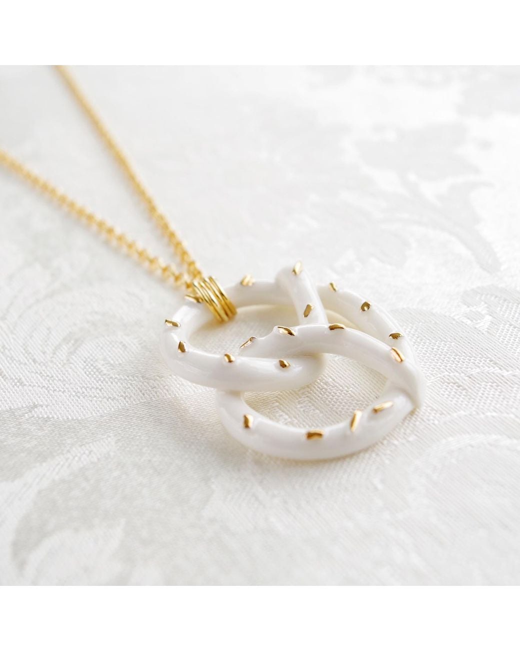 POPORCELAIN Metallic Golden Salted Porcelain Pretzel Pendant Necklace