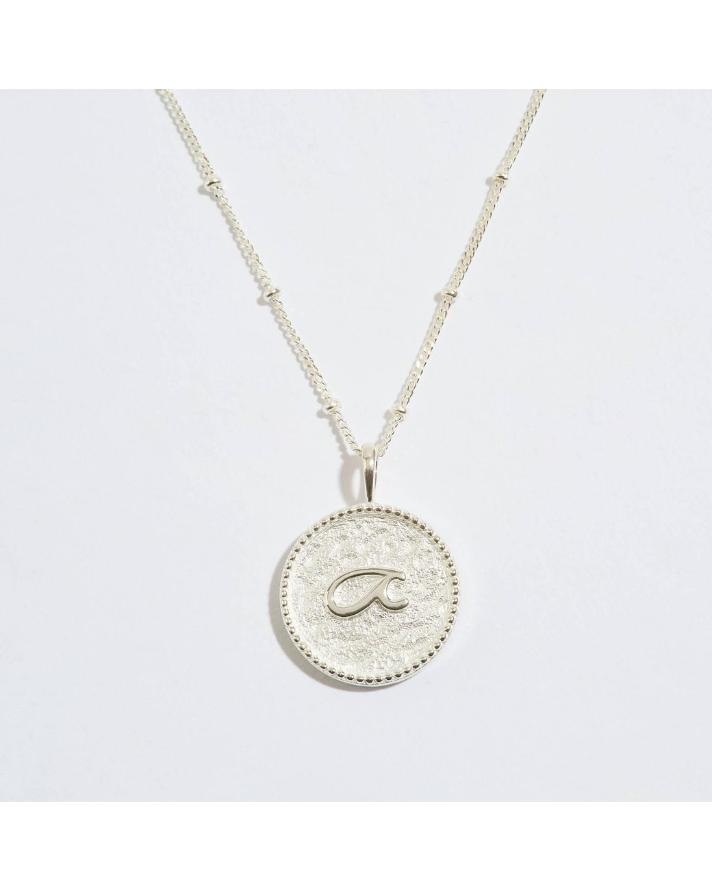 Claire Hill Designs Metallic Fuck Shorthand Coin Necklace