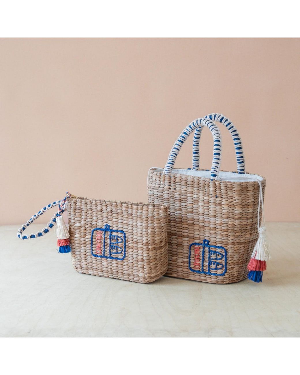 LIKHÂ Blue Neutrals Handwoven Seagrass Sardine Can Tote Bag With Tassels