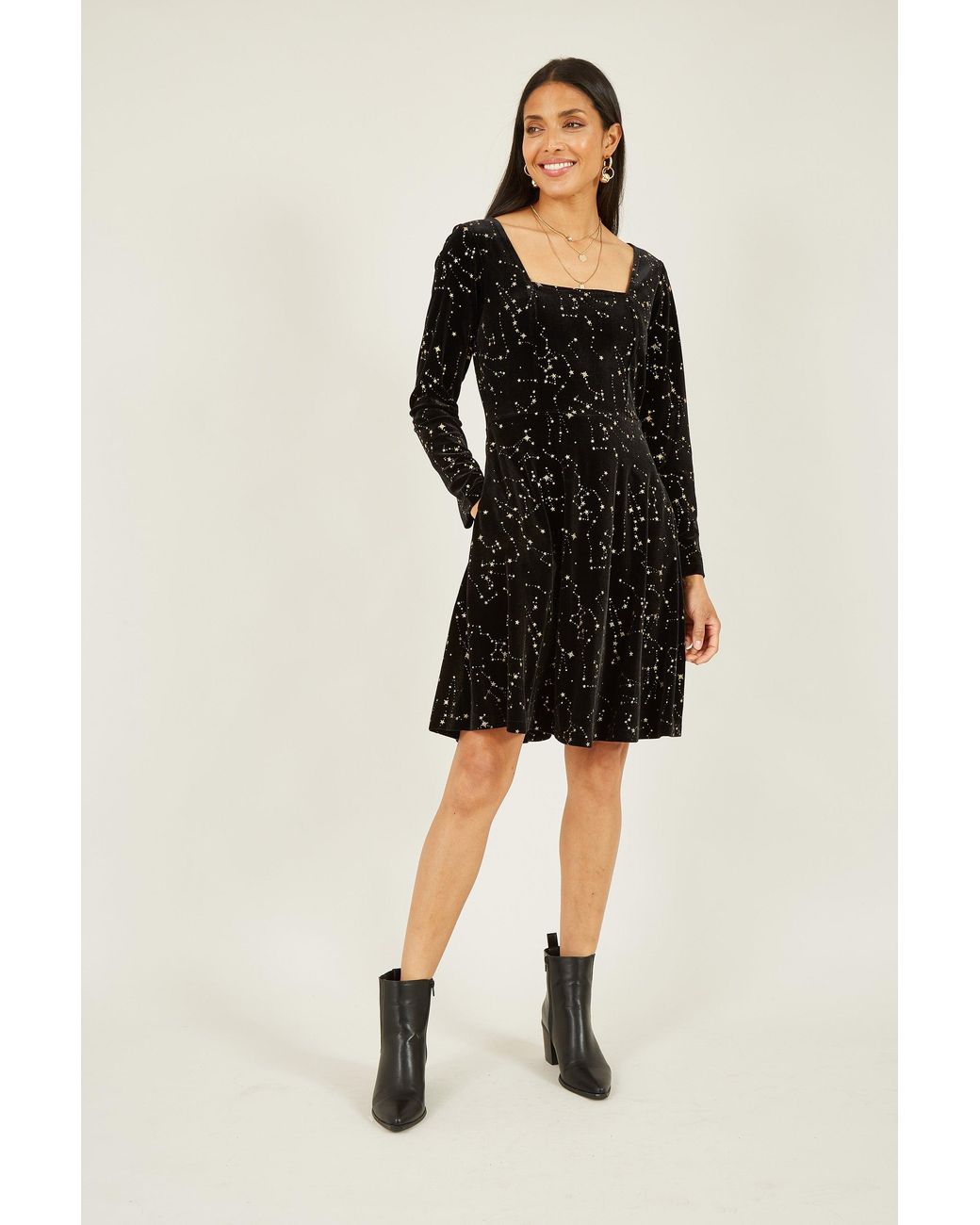 Yumi' Black Star Foil Print Long Sleeve Skater Dress