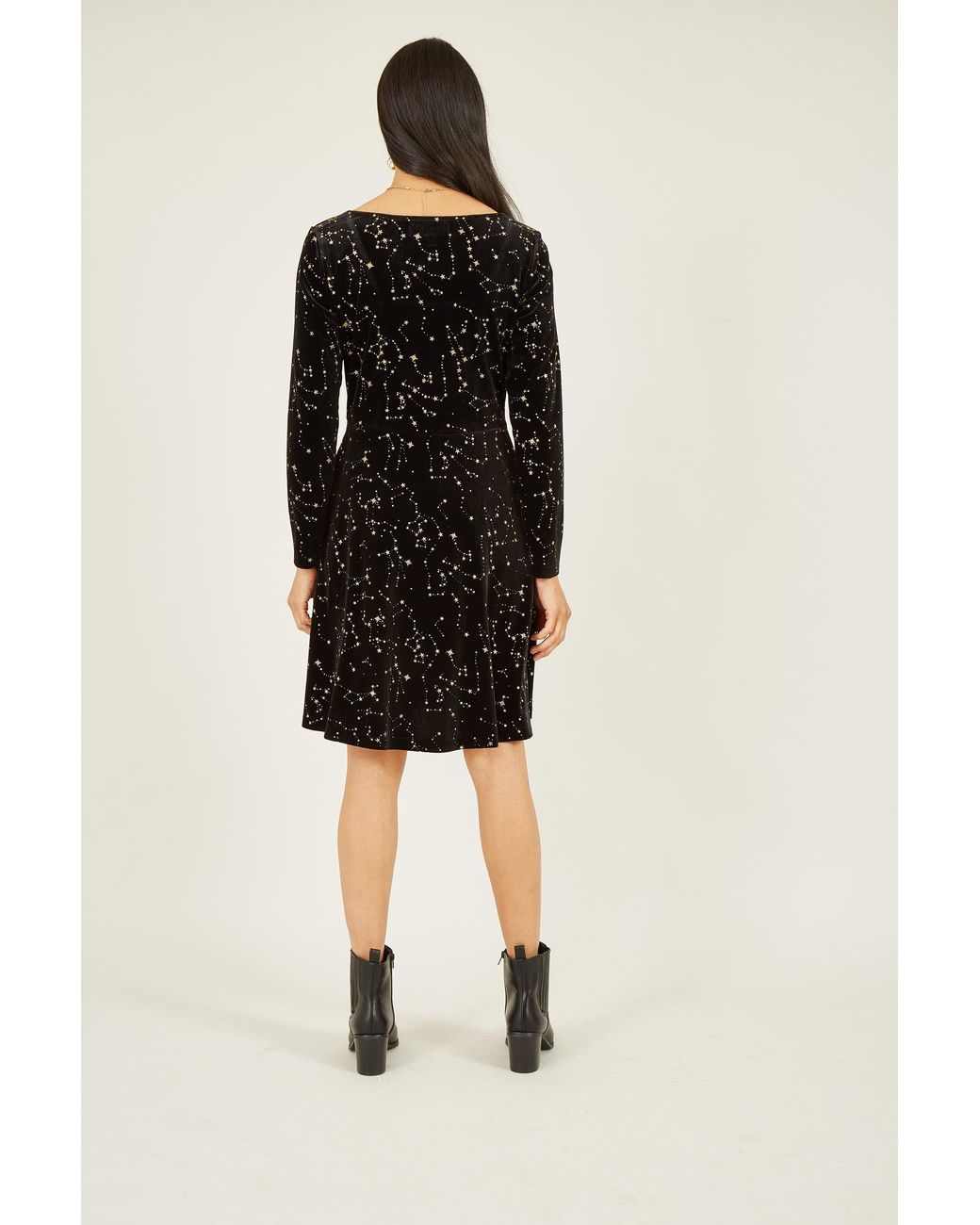 Yumi' Black Star Foil Print Long Sleeve Skater Dress