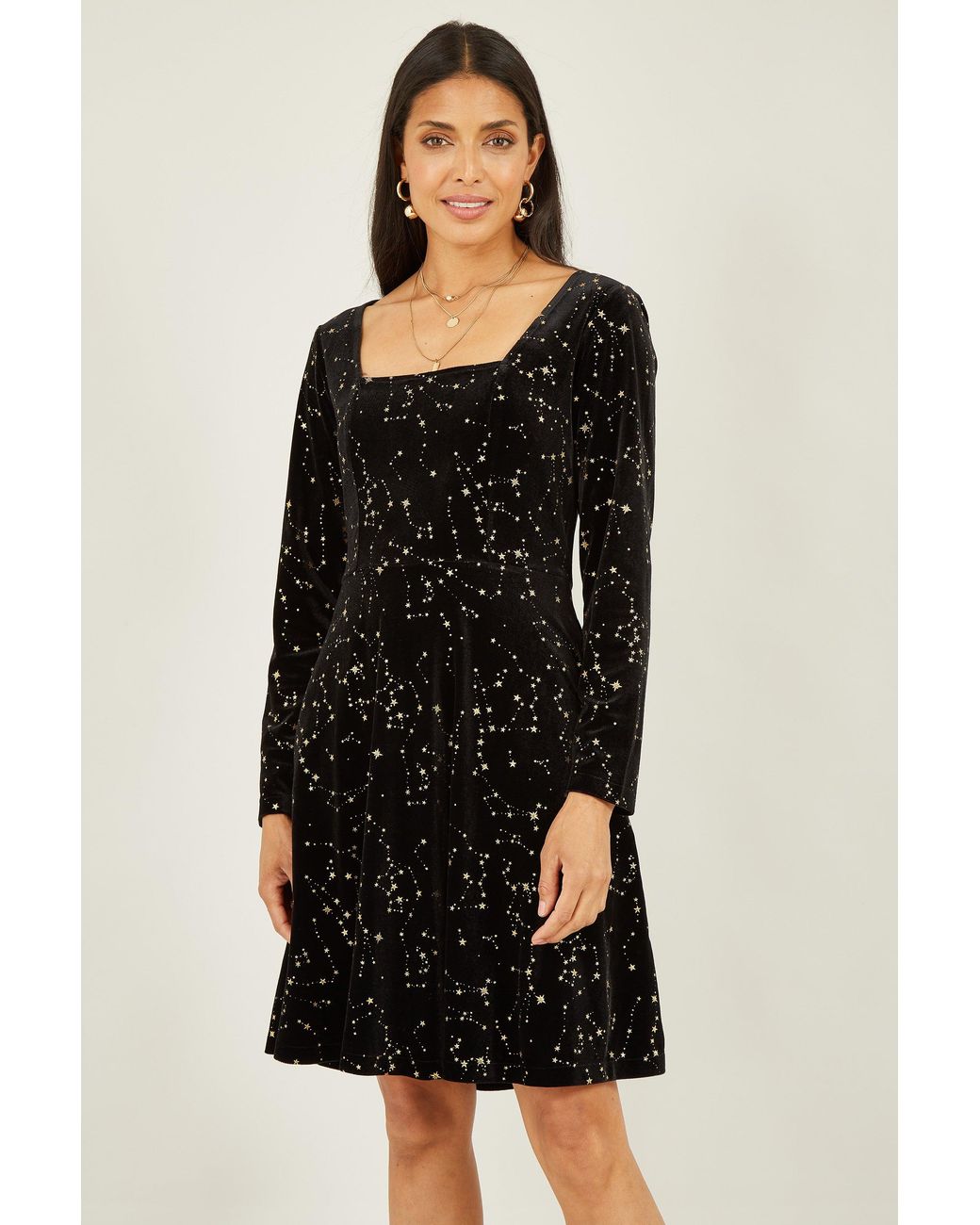 Yumi' Black Star Foil Print Long Sleeve Skater Dress