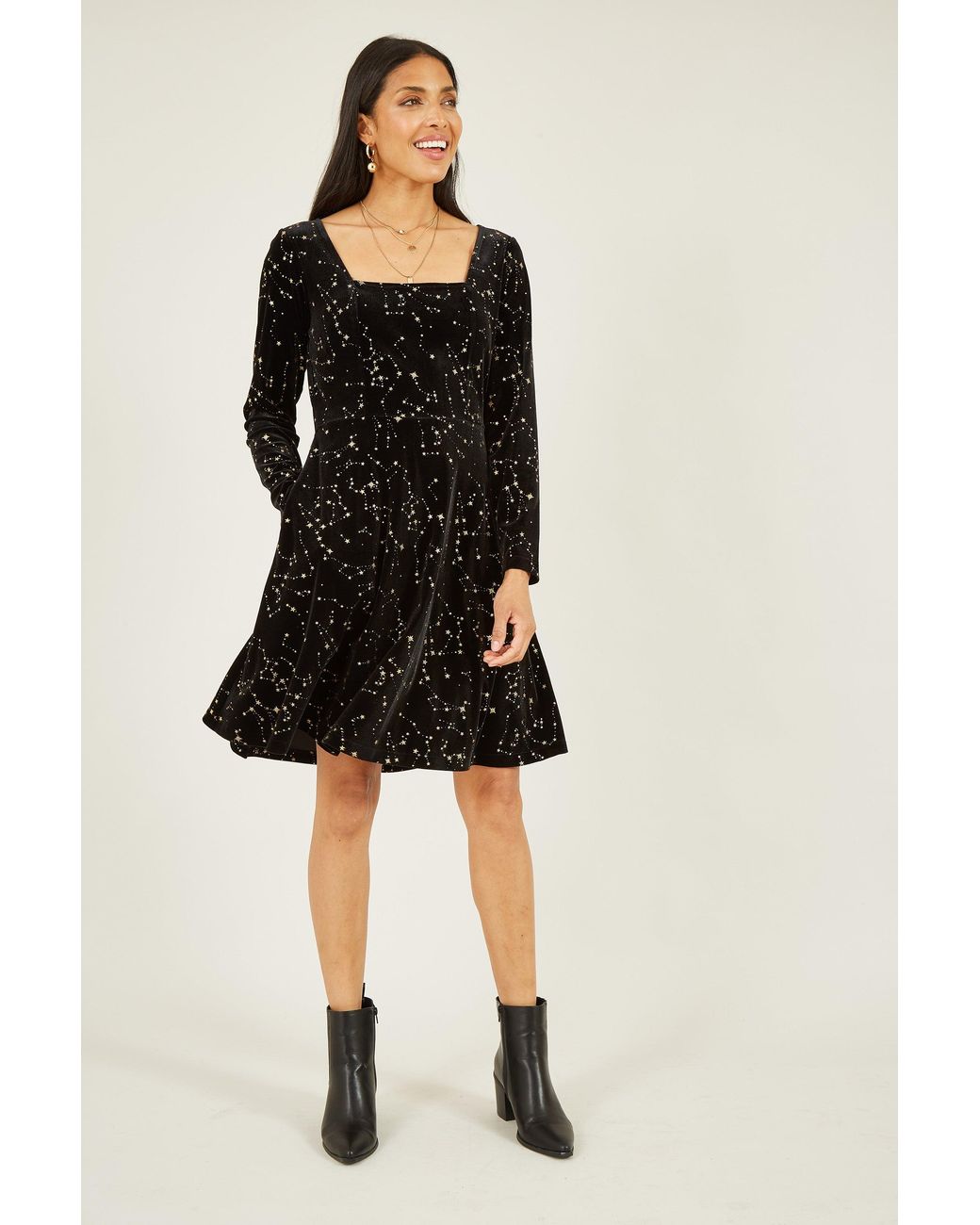 Yumi' Black Star Foil Print Long Sleeve Skater Dress