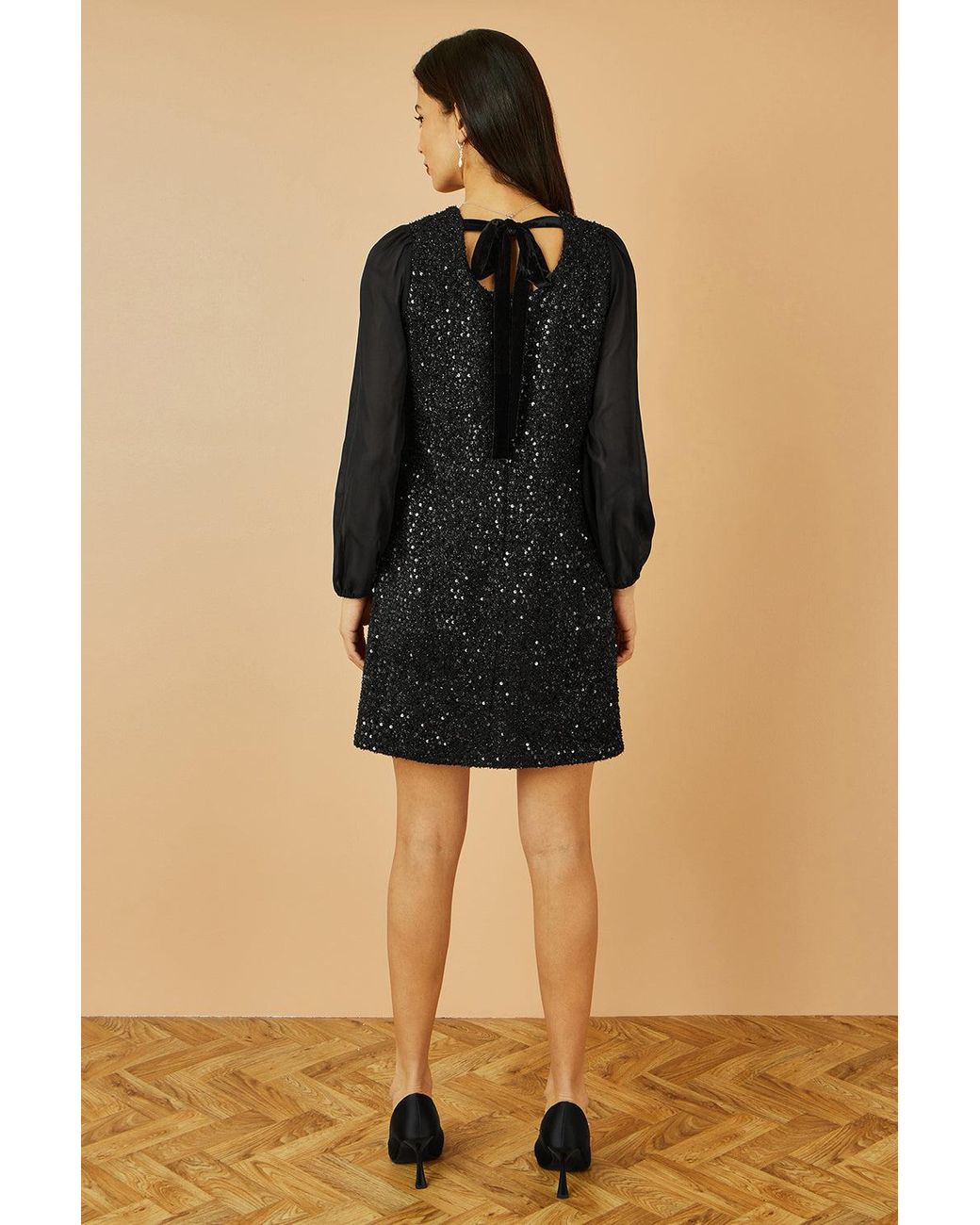 Yumi' Black Sequin Tunic With Tie Back And Sheer Sleeves