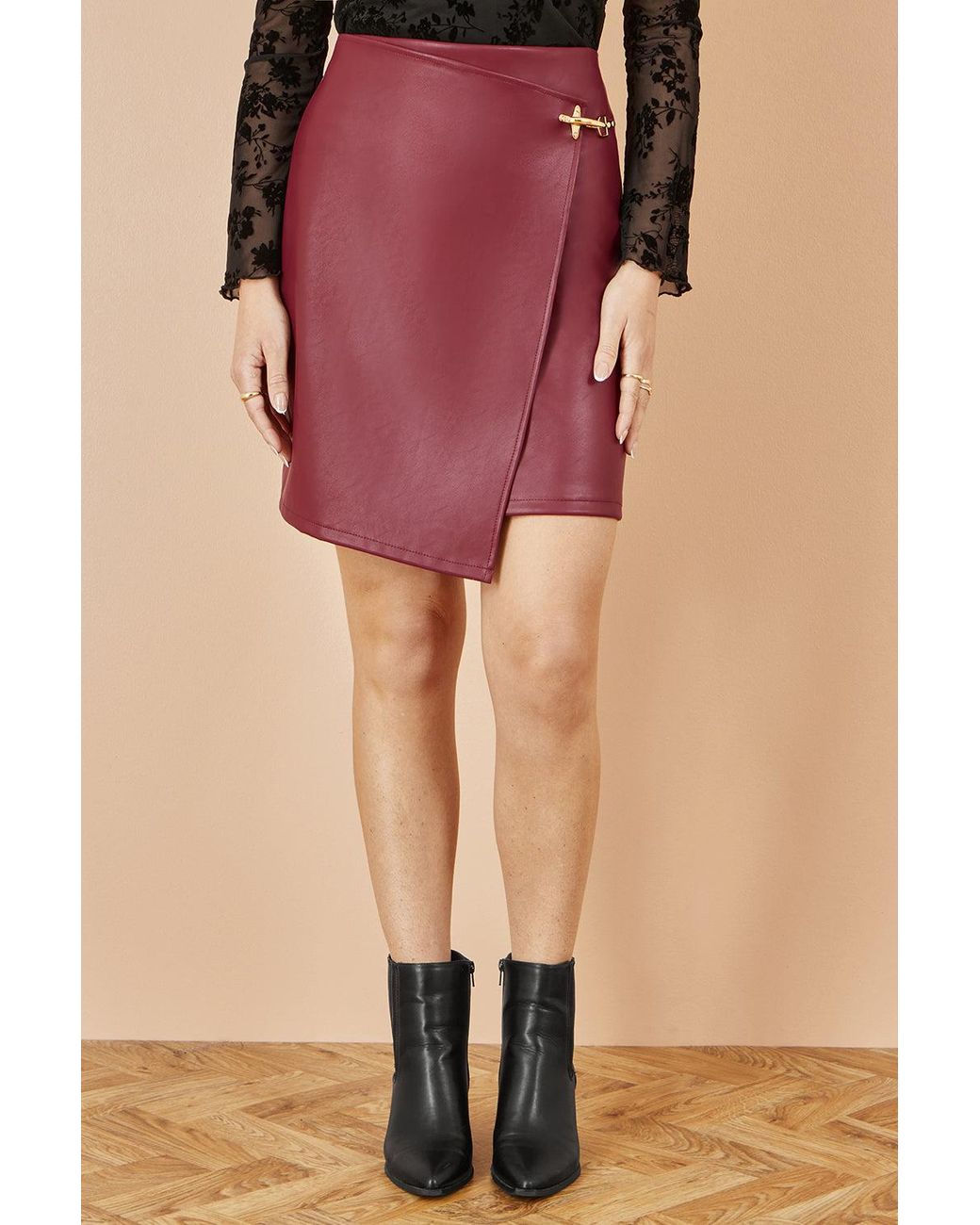 Yumi' Black Faux Leather Wrap Mini Skirt