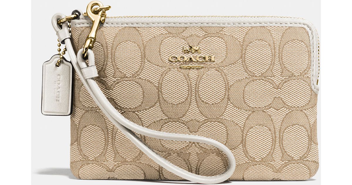 Coach Corner Zip Wristlet In Signature Fabric Metallic Lyst